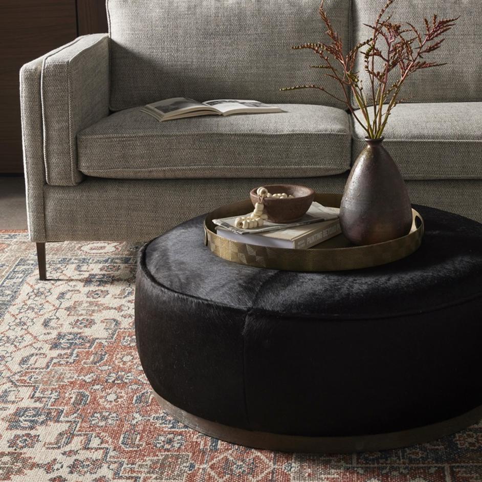 Sinclair Large Round Ottoman - Dark Hair on Hide by Four Hands