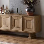 Wooden sideboard with ornate paneling, displaying assorted liquor bottles and glasses.