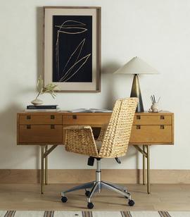 oak office desk with cane offic chair and decor