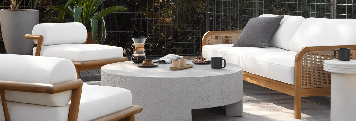 white outdoor sofa with chairs and coffee table