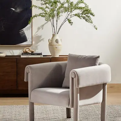 gray fabric chair in room with decor