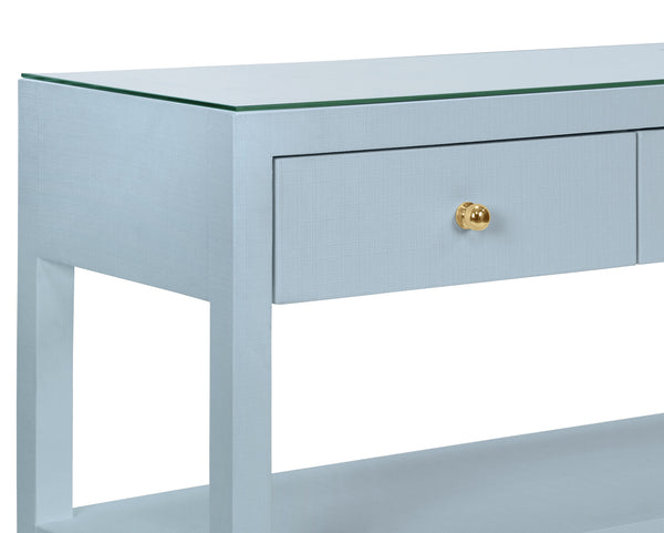 THREE DRAWER CONSOLE WITH TWO OPEN SHELVES IN TEXTURED LIGHT BLUE LINEN WITH POLISHED BRASS KNOBS