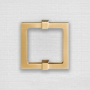 FOUR DOOR BUFFET WITH LARGE BRASS SQUARE HARDWARE IN WHITE TEXTURED LINEN