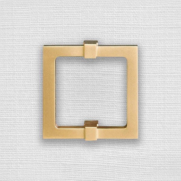 FOUR DOOR BUFFET WITH LARGE BRASS SQUARE HARDWARE IN WHITE TEXTURED LINEN