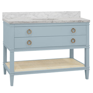 BATH VANITY IN MATTE LIGHT BLUE LACQUER WITH OPEN CANE SHELF, WHITE MARBLE TOP, PORCELAIN SINK, AND ANTIQUE BRASS RING HARDWARE, 48" WIDE