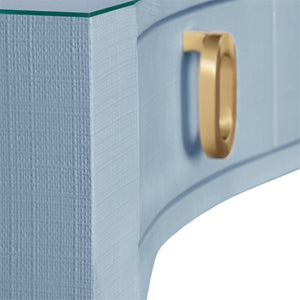 CURVED FRONT DESK WITH THREE DRAWERS IN LIGHT BLUE TEXTURED LINEN WITH SATIN BRASS RING HARDWARE AND GLASS TOP