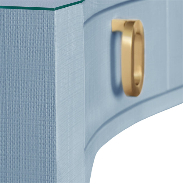 CURVED FRONT DESK WITH THREE DRAWERS IN LIGHT BLUE TEXTURED LINEN WITH SATIN BRASS RING HARDWARE AND GLASS TOP