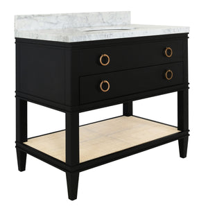 BATH VANITY IN MATTE BLACK LACQUER WITH OPEN CANE SHELF, WHITE MARBLE TOP, PORCELAIN SINK, AND ANTIQUE BRASS RING HARDWARE