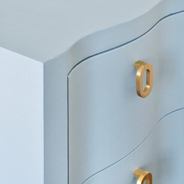 CURVED FRONT SIDE TABLE WITH TWO DRAWERS IN LIGHT BLUE TEXTURED LINEN WITH SATIN BRASS RING HARDWARE