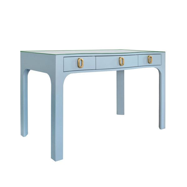 CURVED FRONT DESK WITH THREE DRAWERS IN LIGHT BLUE TEXTURED LINEN WITH SATIN BRASS RING HARDWARE AND GLASS TOP