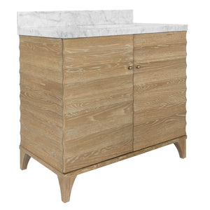 BATH VANITY WITH HORIZONTAL FLUTED DETAIL IN CERUSED OAK WITH WHITE MARBLE TOP, PORCELAIN SINK, AND POLISHED BRASS KNOBS