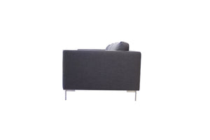 Taut sofa in dark grey tweed with brushed SS legs