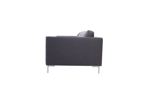 Taut sofa in dark grey tweed with brushed SS legs
