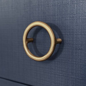 THREE DRAWER CHEST WITH ANTIQUE BRASS CIRCLE HARDWARE IN TEXTURED NAVY LINEN