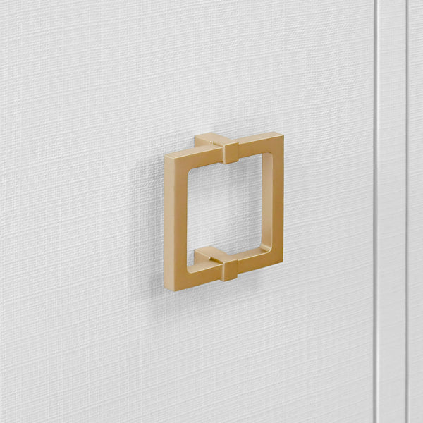 FOUR DOOR BUFFET WITH LARGE BRASS SQUARE HARDWARE IN WHITE TEXTURED LINEN