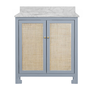 BATH VANITY IN MATTE LIGHT BLUE LACQUER WITH CANE FRONT DOORS, WHITE MARBLE TOP, PORCELAIN SINK, AND POLISHED BRASS KNOBS