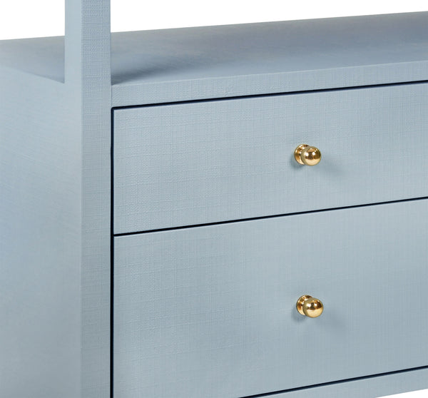 SIX DRAWER CONSOLE WITH OPEN SHELF IN TEXTURED LIGHT BLUE LINEN WITH POLISHED BRASS KNOBS