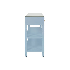 THREE DRAWER CONSOLE WITH TWO OPEN SHELVES IN TEXTURED LIGHT BLUE LINEN WITH POLISHED BRASS KNOBS