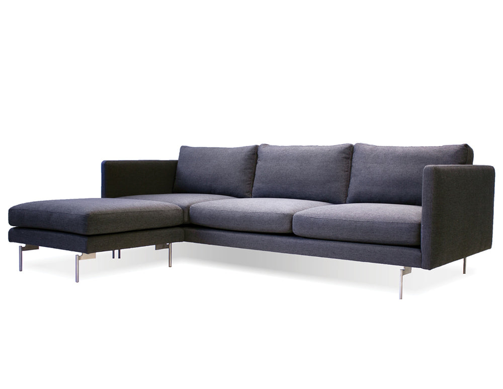 Taut sectional in dark grey with black legs