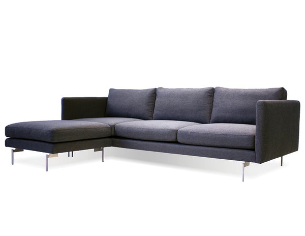 Taut sectional in dark grey with black legs