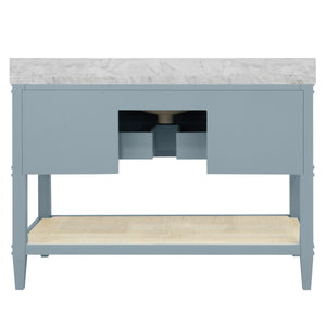 BATH VANITY IN MATTE LIGHT BLUE LACQUER WITH OPEN CANE SHELF, WHITE MARBLE TOP, PORCELAIN SINK, AND ANTIQUE BRASS RING HARDWARE, 48" WIDE