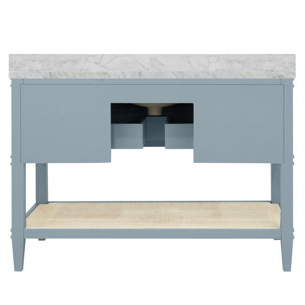 BATH VANITY IN MATTE LIGHT BLUE LACQUER WITH OPEN CANE SHELF, WHITE MARBLE TOP, PORCELAIN SINK, AND ANTIQUE BRASS RING HARDWARE, 48" WIDE