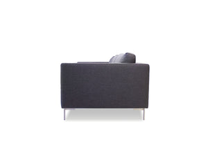 Taut sofa in dark grey tweed with brushed SS legs