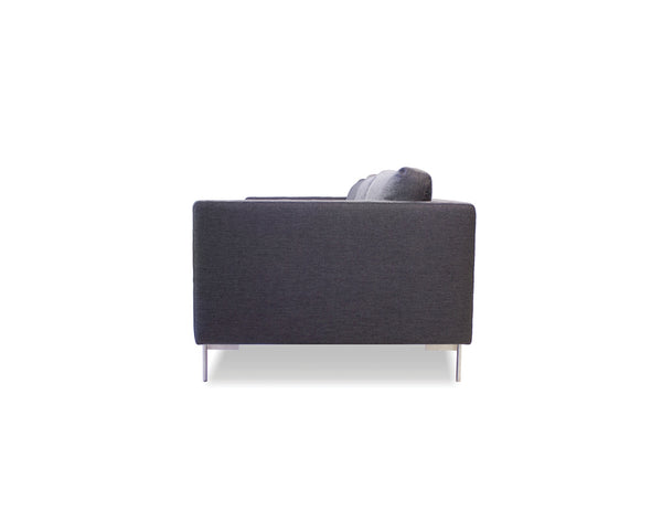 Taut sofa in dark grey tweed with brushed SS legs