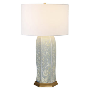 CERAMIC TABLE LAMP WITH SATIN BRASS BASE IN OCEAN REACTIVE GLAZE.