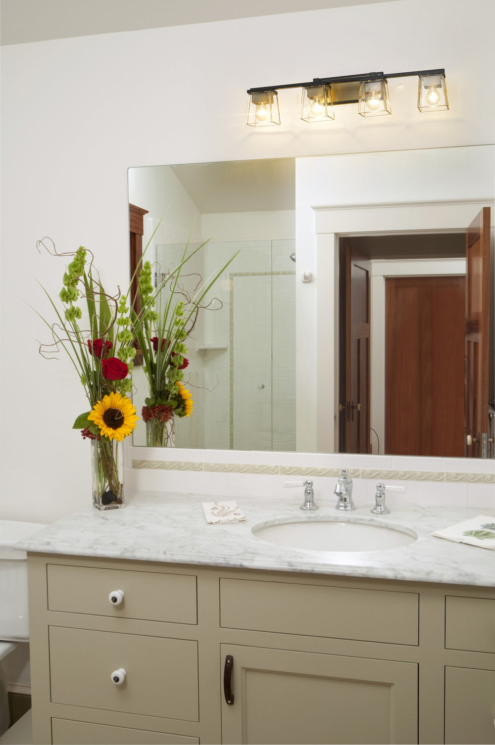 Bleeker Street 4 Light Vanity in Matte Black + Olde Brass Finish