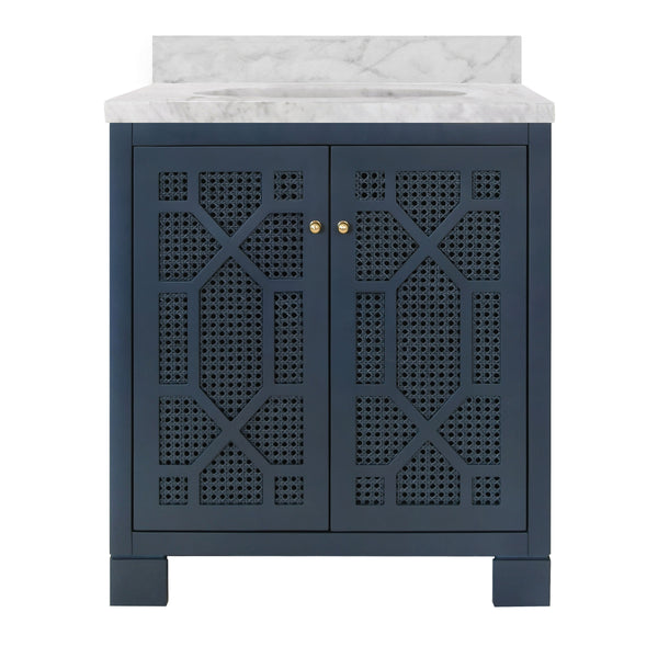 BATH VANITY IN MATTE NAVY LACQUER WITH CANE FRONT DOORS, WHITE MARBLE TOP, PORCELAIN SINK, AND POLISHED BRASS KNOBS