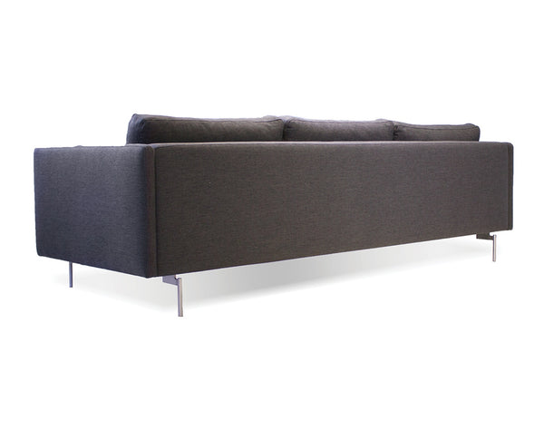 Taut sofa in dark grey tweed with brushed SS legs