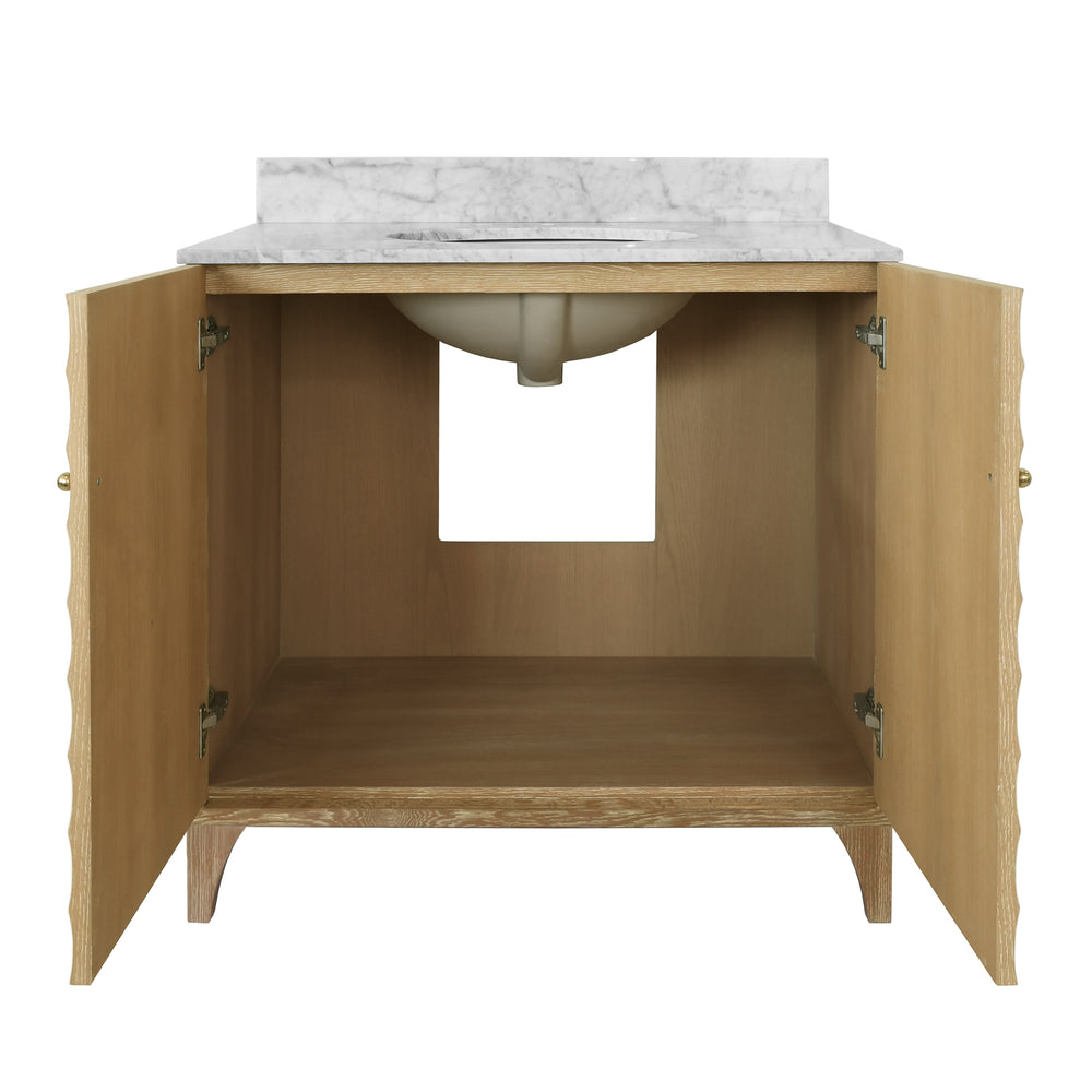 BATH VANITY WITH HORIZONTAL FLUTED DETAIL IN CERUSED OAK WITH WHITE MARBLE TOP, PORCELAIN SINK, AND POLISHED BRASS KNOBS