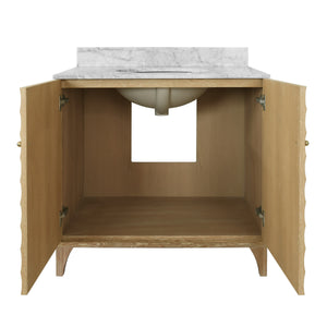 BATH VANITY WITH HORIZONTAL FLUTED DETAIL IN CERUSED OAK WITH WHITE MARBLE TOP, PORCELAIN SINK, AND POLISHED BRASS KNOBS