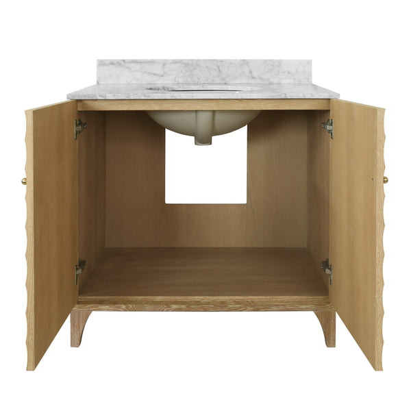BATH VANITY WITH HORIZONTAL FLUTED DETAIL IN CERUSED OAK WITH WHITE MARBLE TOP, PORCELAIN SINK, AND POLISHED BRASS KNOBS