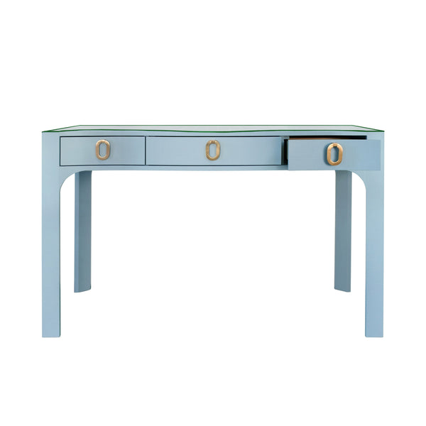 CURVED FRONT DESK WITH THREE DRAWERS IN LIGHT BLUE TEXTURED LINEN WITH SATIN BRASS RING HARDWARE AND GLASS TOP