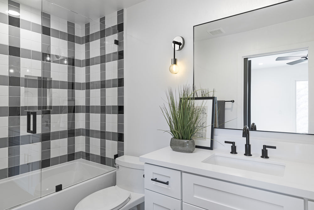 Neutra 1 Light Wall Sconce in Matte Black + Polished Nickel Finish