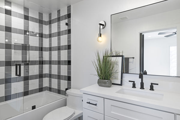 Neutra 1 Light Wall Sconce in Matte Black + Polished Nickel Finish