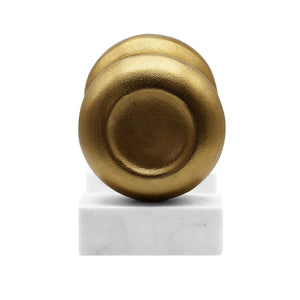 DISK SHAPED TEXTURED BRASS METAL BOOKEND WITH SQUARE WHITE MARBLE BASE