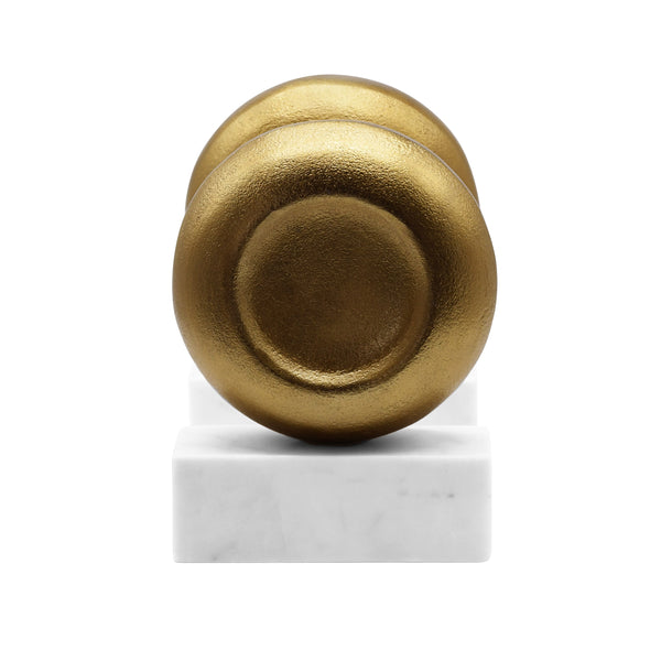 DISK SHAPED TEXTURED BRASS METAL BOOKEND WITH SQUARE WHITE MARBLE BASE