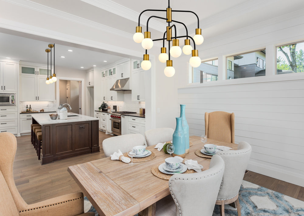 Neutra 9 Light Chandelier in Matte Black + Foundry Brass Finish