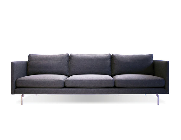 Taut sofa in dark grey tweed with brushed SS legs