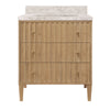 BATH VANITY WITH VERTICAL FLUTED DETAIL ON DRAWERS IN CERUSED OAK WITH WHITE MARBLE TOP, PORCELAIN SINK, AND POLISHED BRASS KNOBS