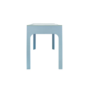 CURVED FRONT DESK WITH THREE DRAWERS IN LIGHT BLUE TEXTURED LINEN WITH SATIN BRASS RING HARDWARE AND GLASS TOP