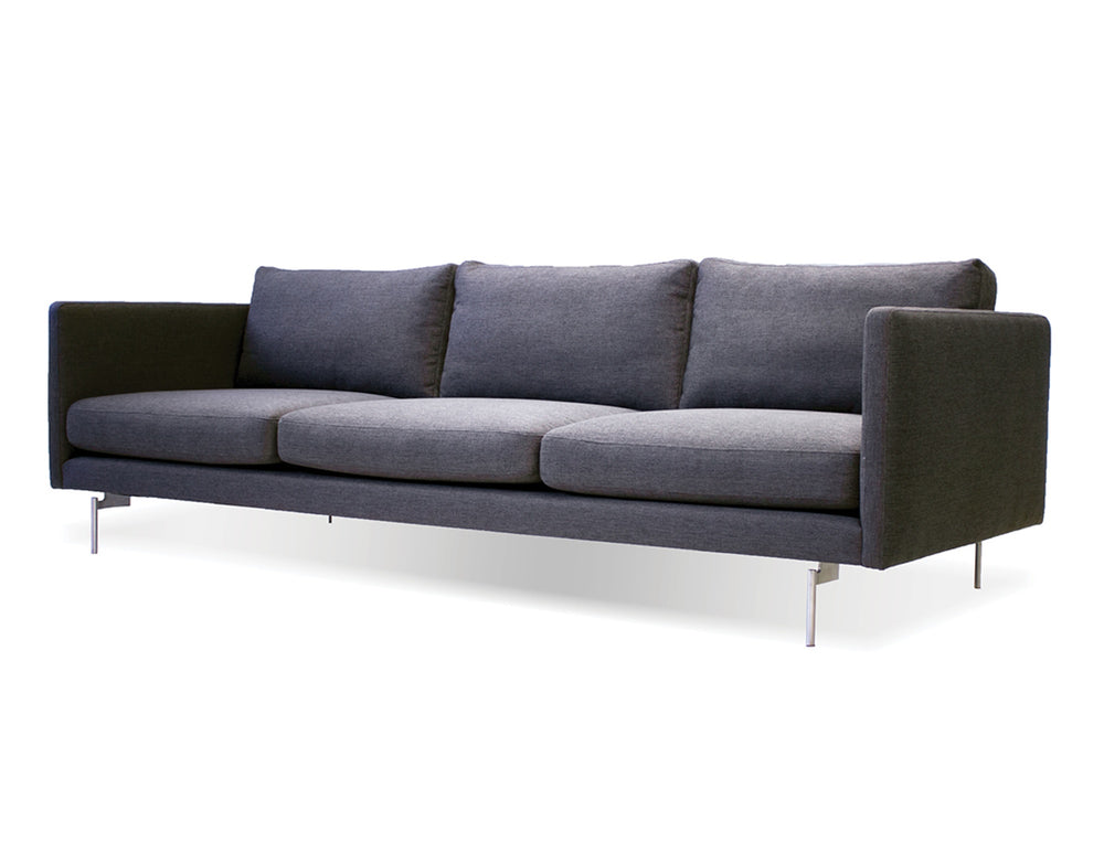 Taut sofa in dark grey tweed with brushed SS legs
