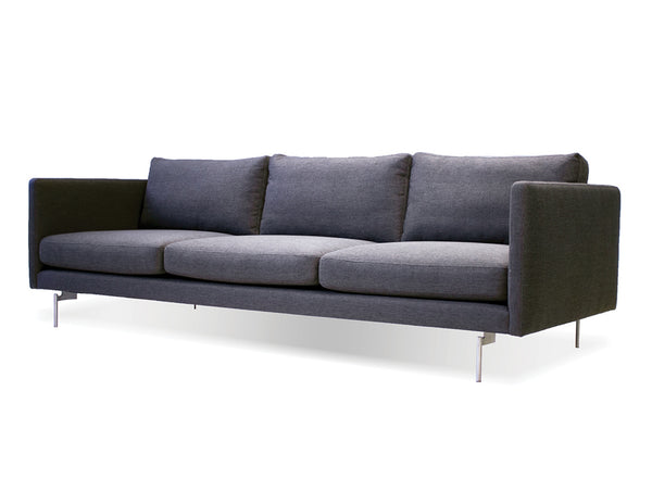 Taut sofa in dark grey tweed with brushed SS legs