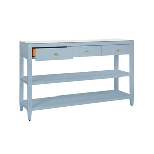 THREE DRAWER CONSOLE WITH TWO OPEN SHELVES IN TEXTURED LIGHT BLUE LINEN WITH POLISHED BRASS KNOBS