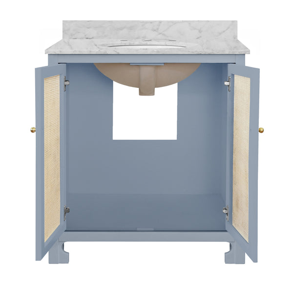 BATH VANITY IN MATTE LIGHT BLUE LACQUER WITH CANE FRONT DOORS, WHITE MARBLE TOP, PORCELAIN SINK, AND POLISHED BRASS KNOBS