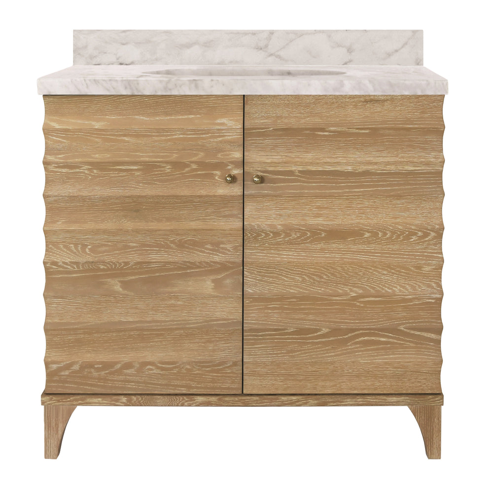 BATH VANITY WITH HORIZONTAL FLUTED DETAIL IN CERUSED OAK WITH WHITE MARBLE TOP, PORCELAIN SINK, AND POLISHED BRASS KNOBS