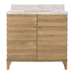 BATH VANITY WITH HORIZONTAL FLUTED DETAIL IN CERUSED OAK WITH WHITE MARBLE TOP, PORCELAIN SINK, AND POLISHED BRASS KNOBS